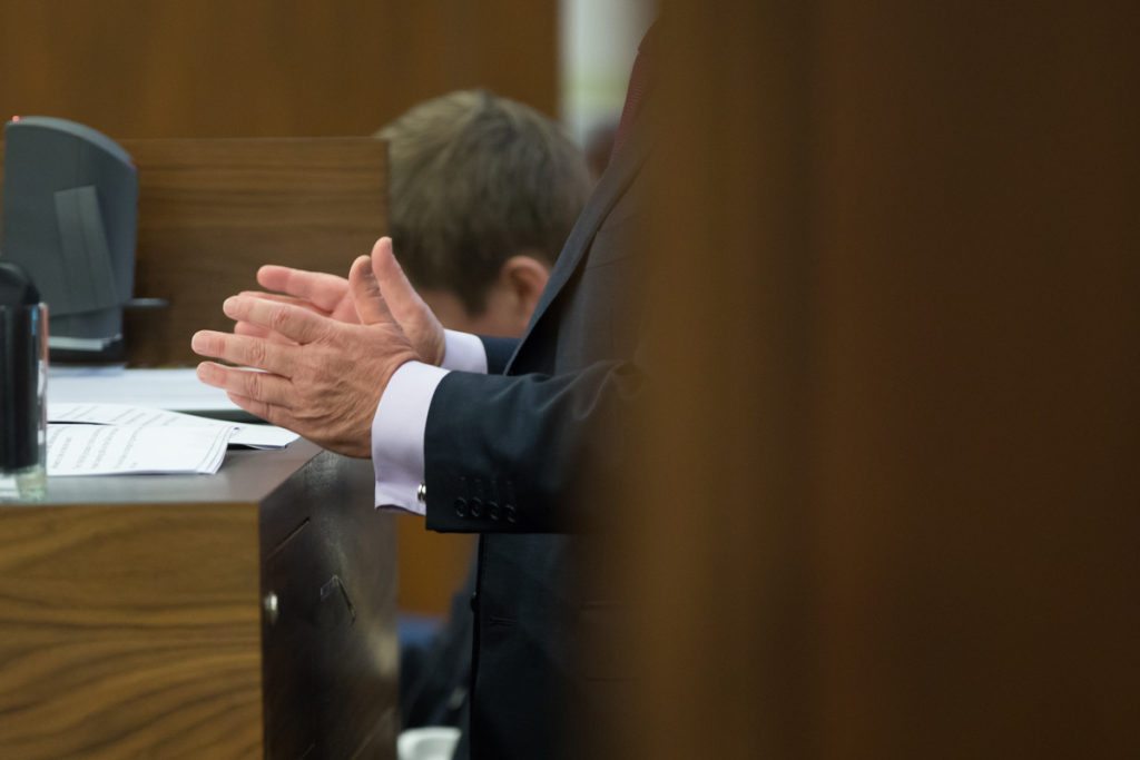 Harrison Photography & Media Ltd covering CGAI Speaking Up conference in Chartered Accountants Ireland on Pearse Street. Conference detail of hands at the podium. 