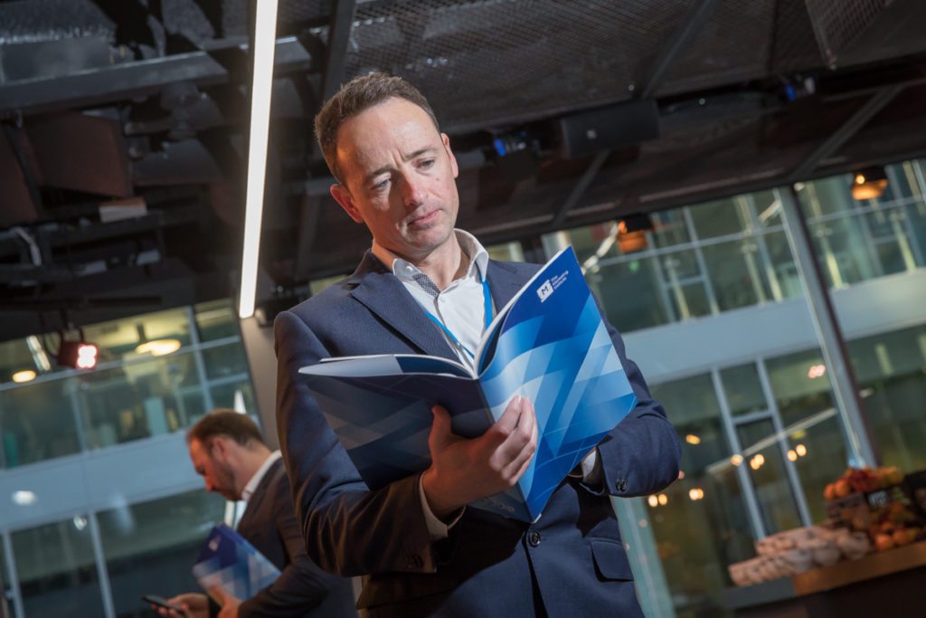 Google Foundry Dublin CMO Summit delegate reading brochure